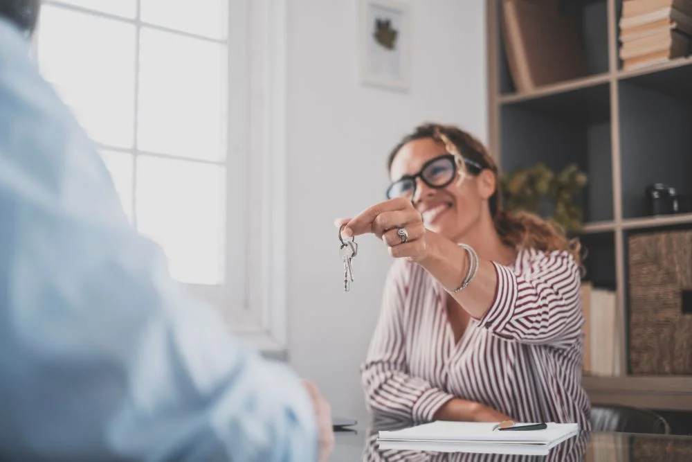 Woman handing out keys